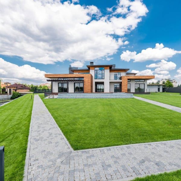 Lush green sod installation creating a pristine front yard landscape